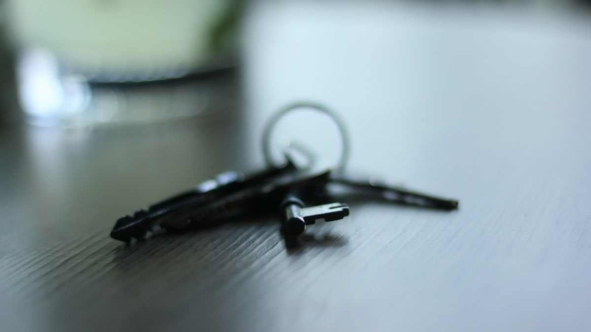 The house was quiet and it was raining outside. The keys lay on the table, just there, almost saying, why don't you open the gate and step outside?